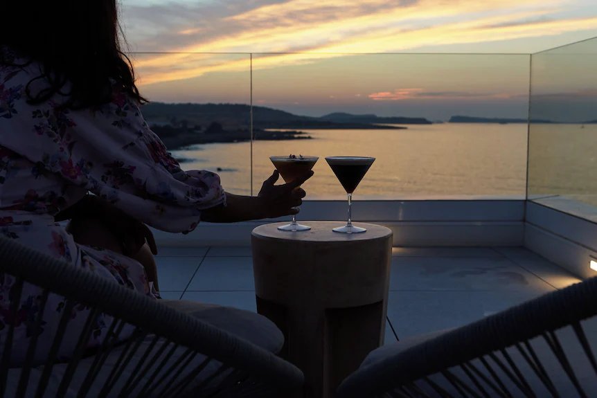 Sunset drinks on the terrace at Can Talaia, looking over the bay
